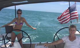 Guest and a member of the crew, sailing the yacht Summerwind offshore