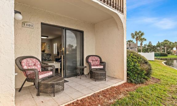 This view of a first floor unit at Ocean & Racquet Resort shows their patio, and it's proximity to one of the ponds