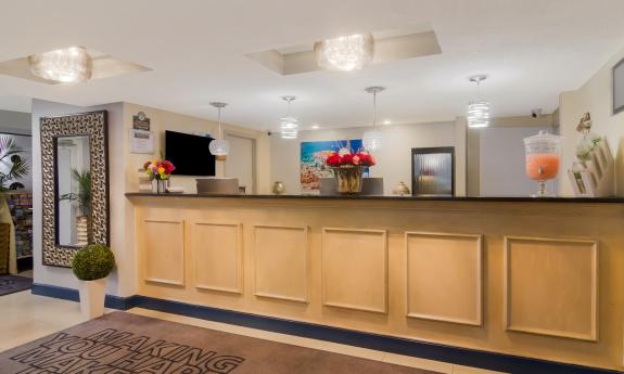 This wood-paneled reception counter offers a warm welcome to guests at Ocean Sands