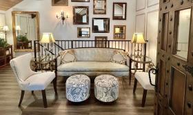 Brides and hosts can relax in this upstairs lounge, furnished with a settee and chairs at 9 Aviles in St. Augustine