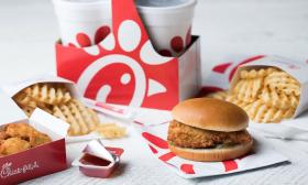 Chick-fil-A to go order featuring a chicken sandwich, waffle fries, chicken nuggets, and two drinks