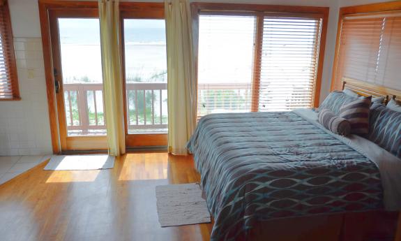 Sunstate Vacation Rentals — Bedroom with waterside view