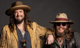 Music duo War Hippies poses for promo shot, smiling