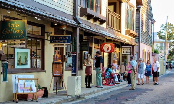 Art lovers browse the galleries on Aviles Street at the Friday Night Art Walk in St. Augustine, FL