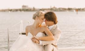 The bride and groom, in a quiet and loving moment aboard a catamarn from St. Augustine Sailing