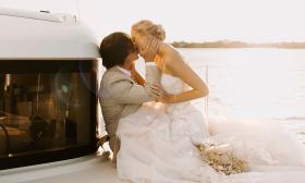 A luxury catamaran from St. Augustine Sailing presents the perfect setting for a post-wedding kiss