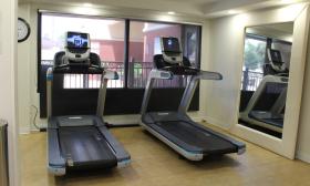 Two treadmills set up in front of a window at the DoubleTree by Hilton in St. Augustine