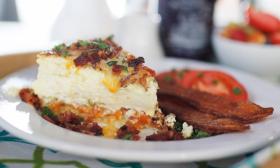 A grits-crusted quiche atop a white plate at breakfast in the Bayfront Wescott House
