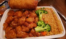 Takeout with fried rice and an egg roll
