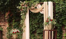 Archway with floral arrangements — Hello Lovely Weddings