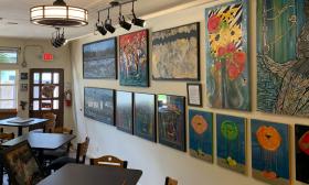 The BART art gallery has art-filled walls and small tables for enjoying wine and conversation