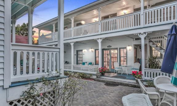 The Bayfront Wescott House shows seating areas on the patio, the porches, and the balconies