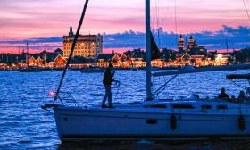 A St. Augustine Sailing boat cruising past the bayfront during Nights of Lights