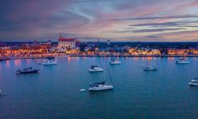 This drone footage captured by St. Augustine Sailing shows the holiday lights against a vibrant sunset