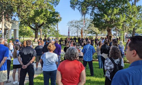 People attending the 9/11 Remembrance Ceremony in 2023, standing of the lawn of the fire station at Malaga Street.