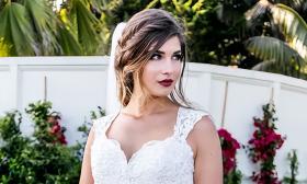 Bride with relaxed updo and red lipstick