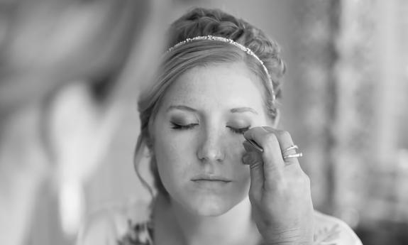 Bride having her makeup applied