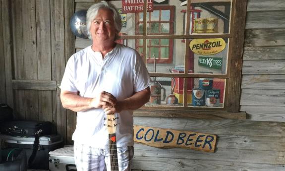 Jim Lamb posing with his guitar