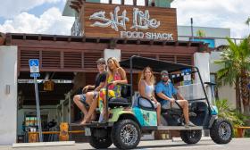 The golf cart from Salt Life Food Shack delivering guests from the local area