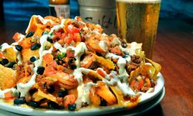 A towering plate of nachos as served at Salt Life Food Shack on St. Augustine Beach