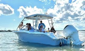 Adventure In Paradise's boat with a group of tourists on board