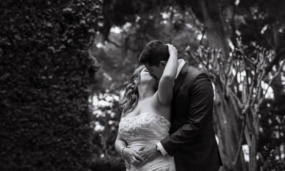 Couple sharing a wedding day kiss