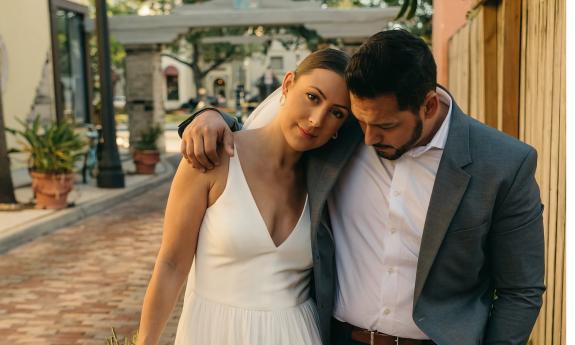 Couple pose for a photo in Historic Downtown