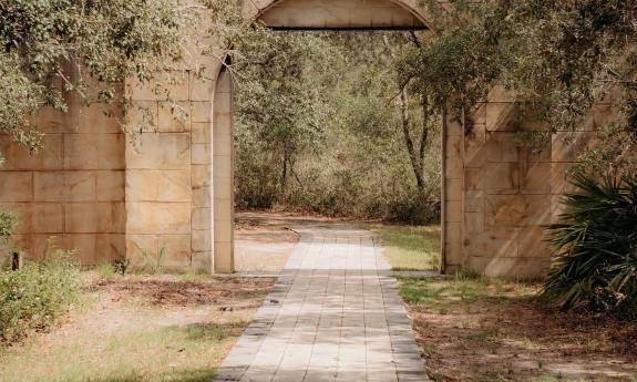 Old archway with stone pathway