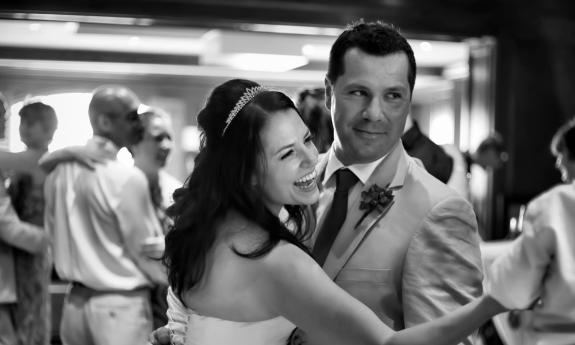 Bride laughs on the dancefloor