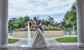 Groom dips bride for a photo
