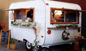 Quick-service coffee trailer with floral decorations