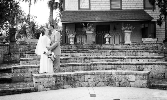 A couple share a kiss on their wedding day