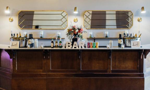 Decorated bar set up for an event at Parlor Room Events