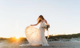 Bride on the beach at sunset