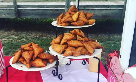 Trays of sambusa on display for a catering event