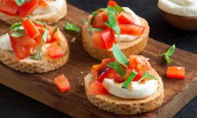A bruschetta dish that is garnished and ready to be served