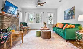 A cozy and colorful family room is a great gathering spot in this Euphoria Rental Home