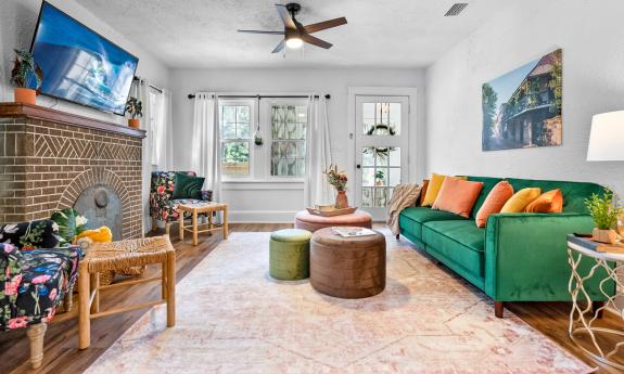 A cozy and colorful family room is a great gathering spot in this Euphoria Rental Home