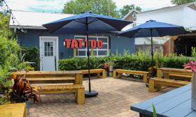 Ink & Barley Tattoos and Brews has a courtyard in the back for guests