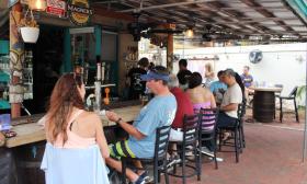The Backyard at Meehan's Island Cafe offers a casual spot for gathering and listening to live music