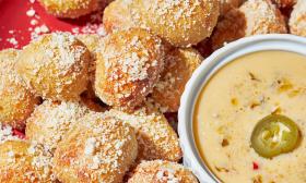 A plate of pretzel bites with spicy beer cheese