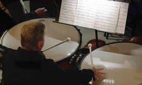 The percussionist with the St. Augustine Orchestra playing the tympany 