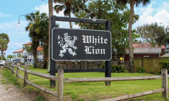 The sign at the entrance to White Lion Bar and Grill