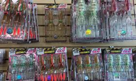 A variety of chase baits stocked along the wall in store