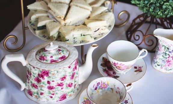 A table decorated and presented for a tea with sandwiches