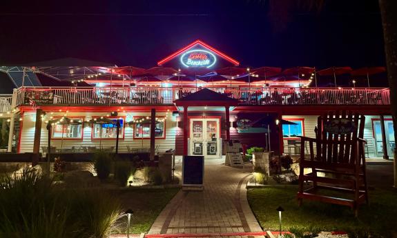 Crabby's Beachside restaurant is well-lit during the night