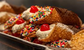 Decorated cannoli's with sprinkles and cherries on top