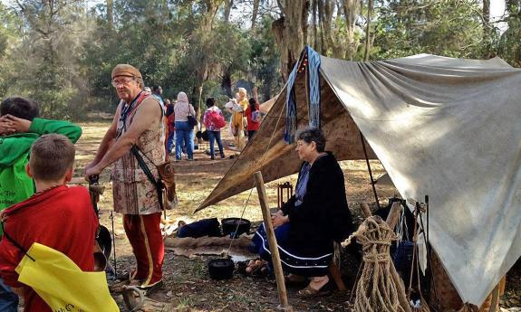 Re-enactors giving a tour to a school group