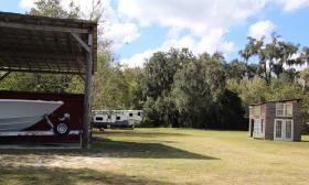 The grounds of Hideaway Trail, against a wooded area, offer boat and RV storage