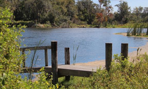 The dock on the stocked pond at the edge of Hideaway Trail